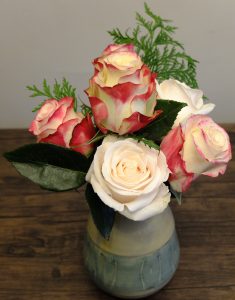 It doesn't take a full dozen roses to pack a punch. These fire and ice roses convey passion.