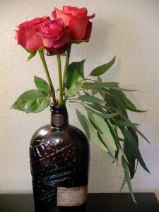 Matilda roses, seeded eucalyptus, glass bottle